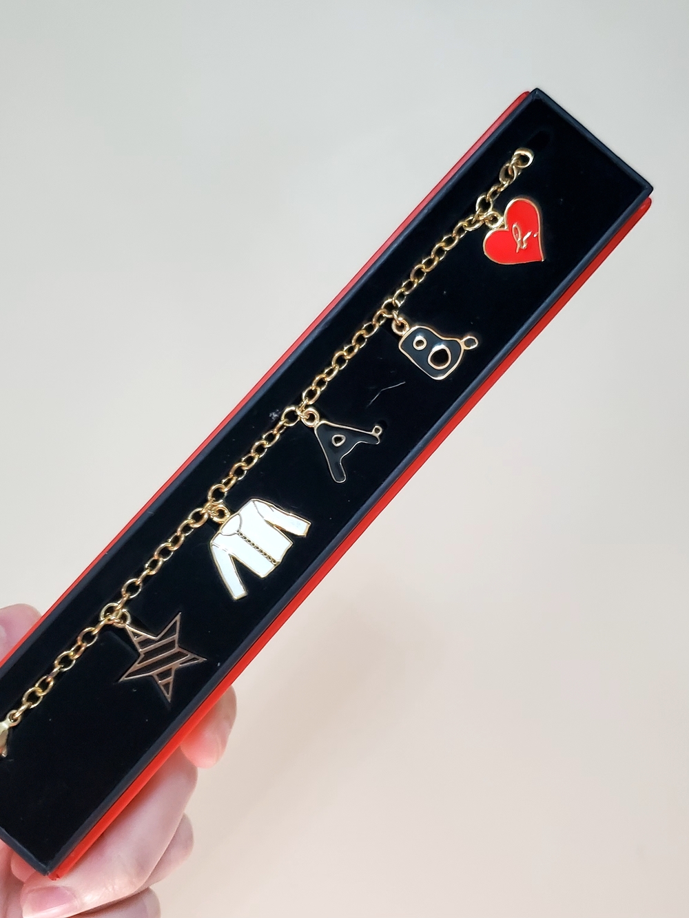 3/$50 Agnes B. Gold Charm Bracelet with Red and White Enamel Charms